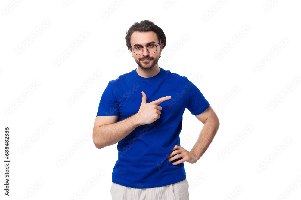 young brunette european man with a beard in a blue t-shirt is inspired by an idea on a white background with copy space