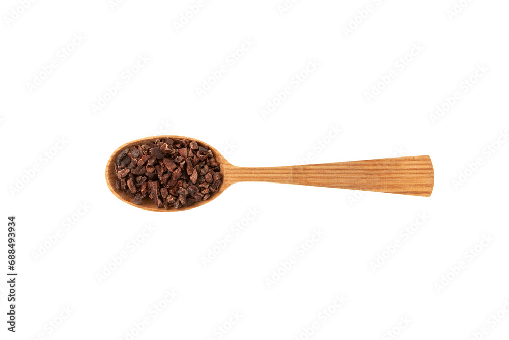 Cacao nibs in wooden spoon on white background. Sugar-free product. Natural antidepressant. Crushed cocoa beans of weak roasting. Good chocolate chip alternative. Cacao nibs in wooden spoon on white background. Sugar-free product. Natural antidepressant. Crushed cocoa beans of weak roasting. Good chocolate chip alternative.