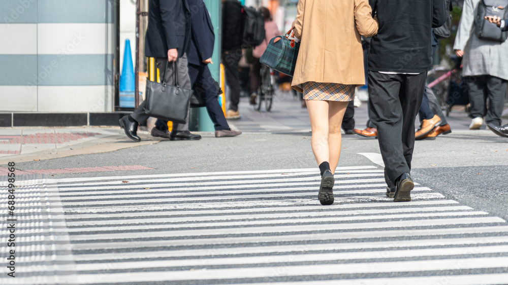 Action of a lovely couple, lady and gentleman, in fashion casual are walk crossing the street together. Action of a lovely couple, lady and gentleman, in fashion casual are walk crossing the street together.