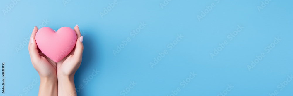 Heart in hands on a minimal background. Charity, health, care, love concept. Heart in hands on a minimal background. Charity, health, care, love concept.