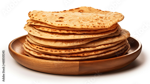 pile of indian canai bread on a wooden plate isolated on a white background