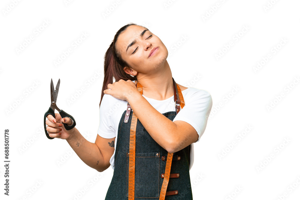 Seamstress woman over isolated chroma key background suffering from pain in shoulder for having made an effort Seamstress woman over isolated chroma key background suffering from pain in shoulder for having made an effort