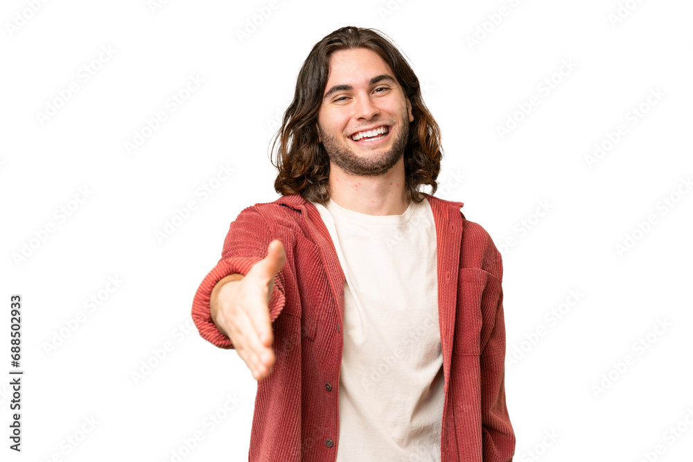 Young handsome man over isolated background shaking hands for closing a good deal