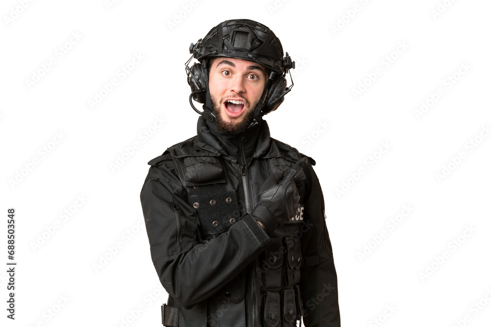 SWAT over isolated chroma key background surprised and pointing side SWAT over isolated chroma key background surprised and pointing side