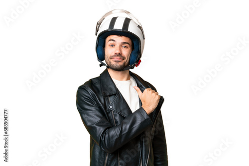 Young caucasian man with a motorcycle helmet over isolated chroma key background proud and self-satisfied