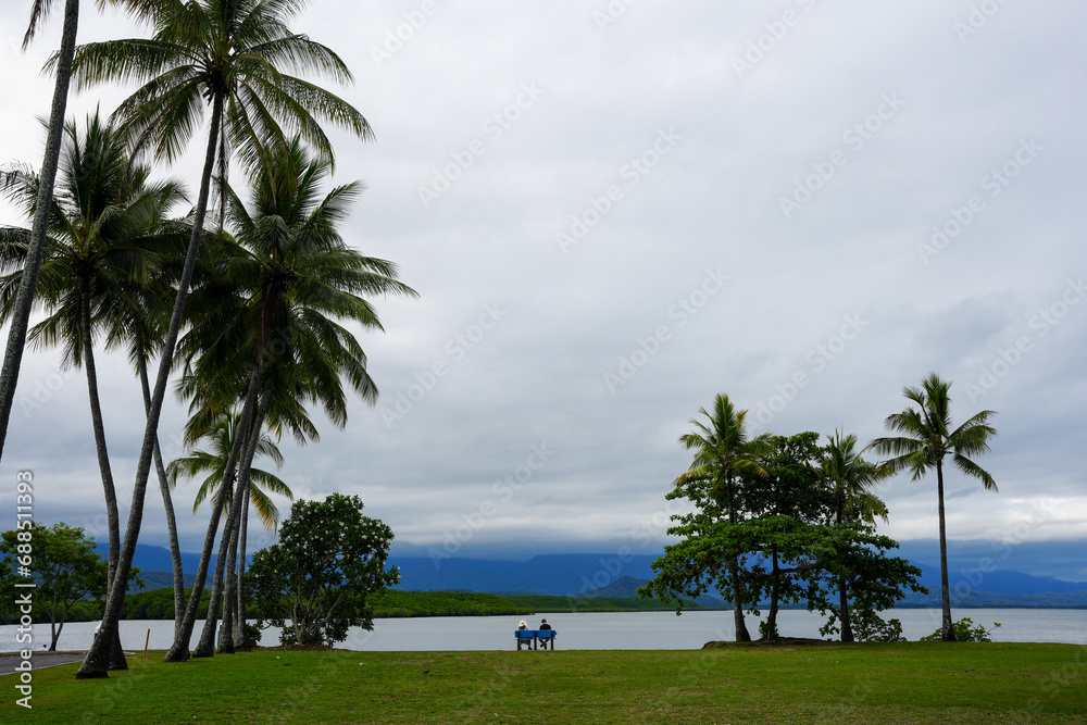 People sitting by the water