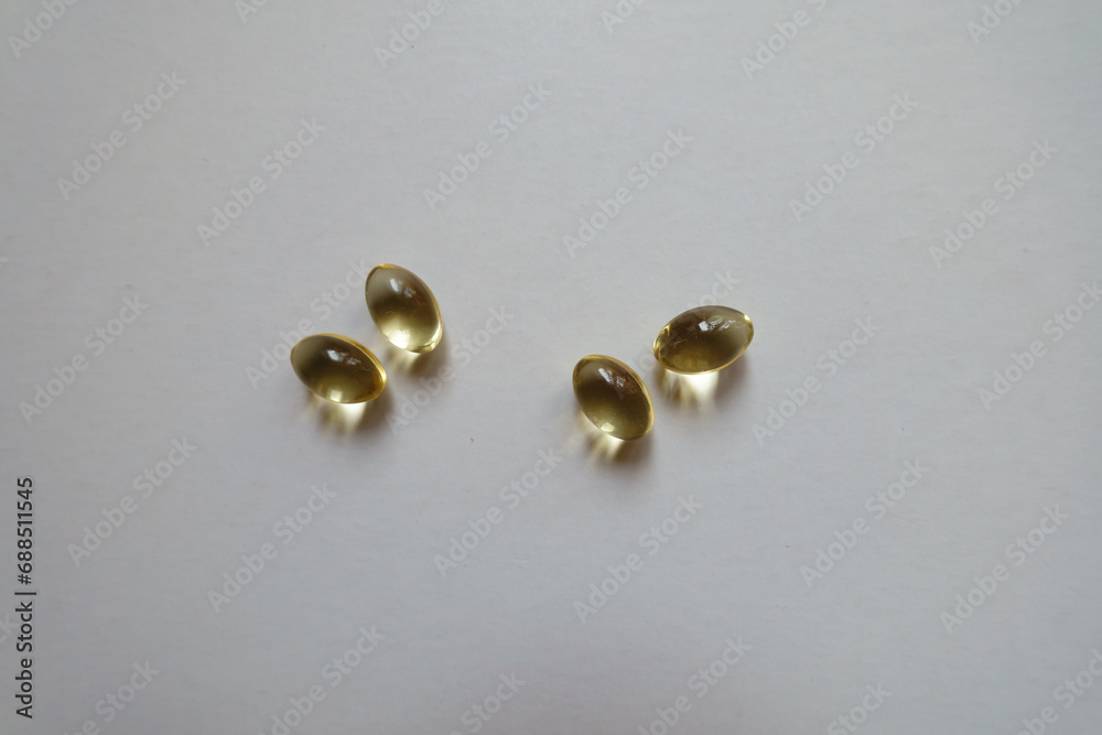 Two pairs of softgel capsules of vitamin D Two pairs of softgel capsules of vitamin D
