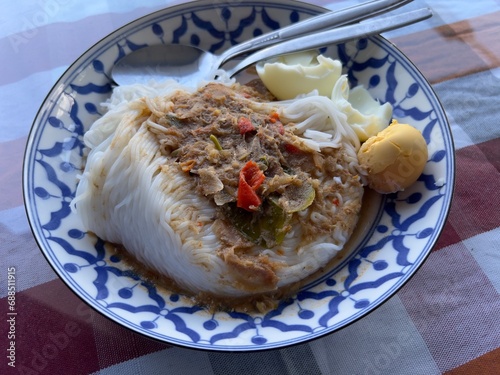 Khanomjeen namyapa , Rice vermicelli with clear minced fishes curry , Thai food. photo