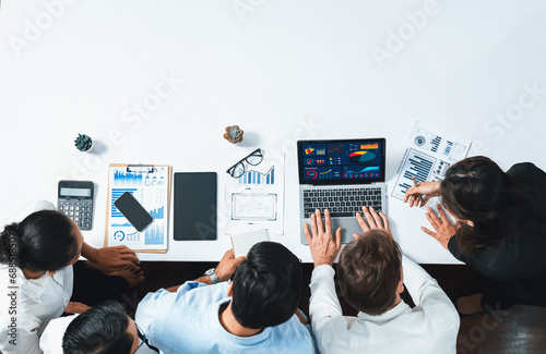 Group of office worker and businesspeople working on business financial data analysis. Empty space with editable blank background meeting table for customer design. Prudent photo