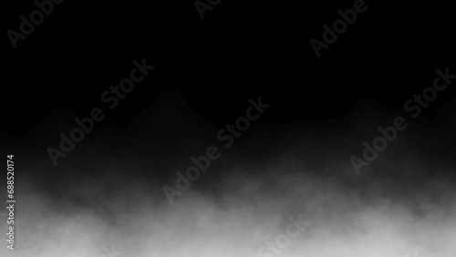 Natural dry ice smoke clouds fog overlay on black background photo