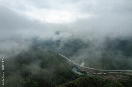 Aerial shot of Mount Huangshan forest winding mountain road in Anhui