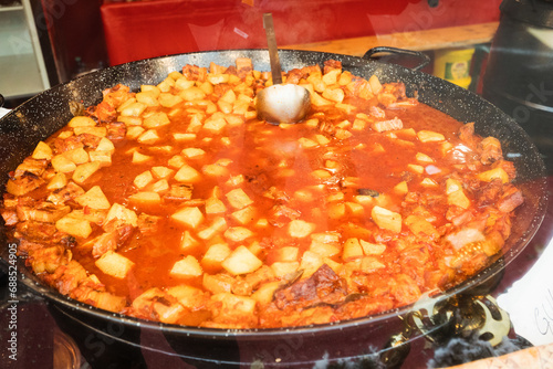 Traditional Romanian dishes from winter market in Timisoara Romania - Fasole cu Carnati (smoked sausages with beans stew) and deep-fried cheese photo