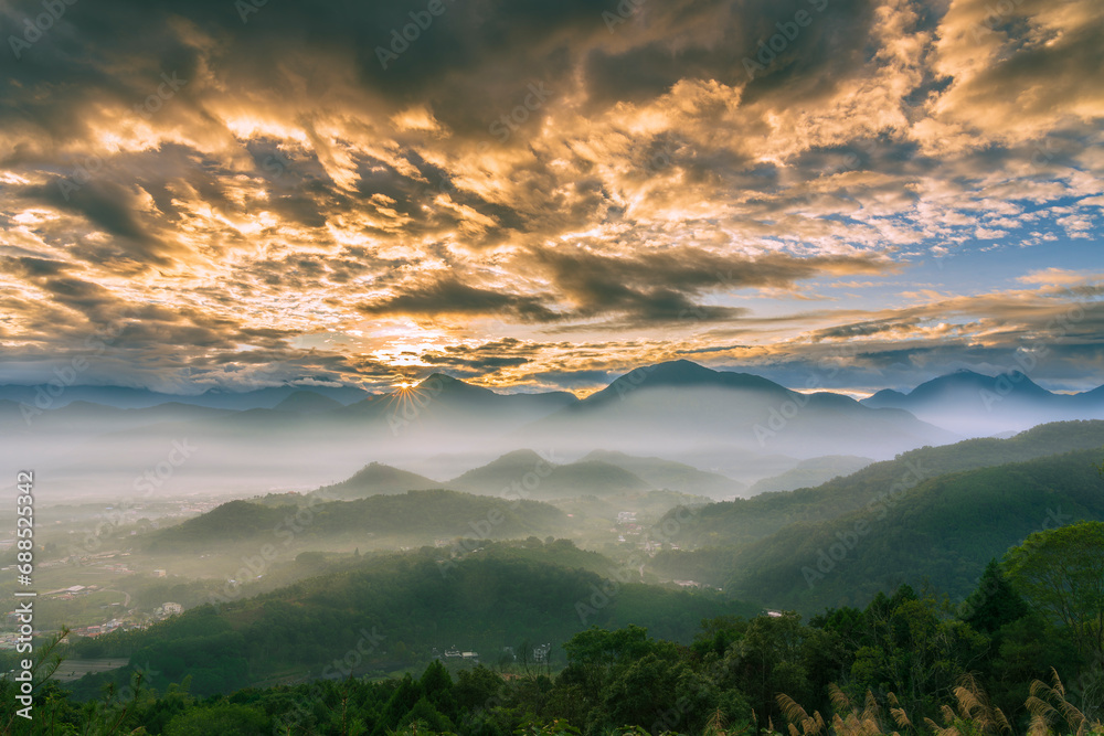 Sunrise in the mountains with fog and mist Sunrise in the mountains with fog and mist