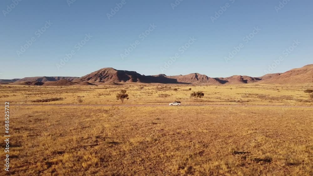 Adventure Across Endless Dunes: 4K drone shot of Desert Drive in Namibia, Africa with Rooftop-Tented 4x4 Toyota Hilux; Epic Off-Road Journey for Travel, Exploration, and Outdoor Enthusiast Videos Adventure Across Endless Dunes: 4K drone shot of Desert Drive in Namibia, Africa with Rooftop-Tented 4x4 Toyota Hilux; Epic Off-Road Journey for Travel, Exploration, and Outdoor Enthusiast Videos