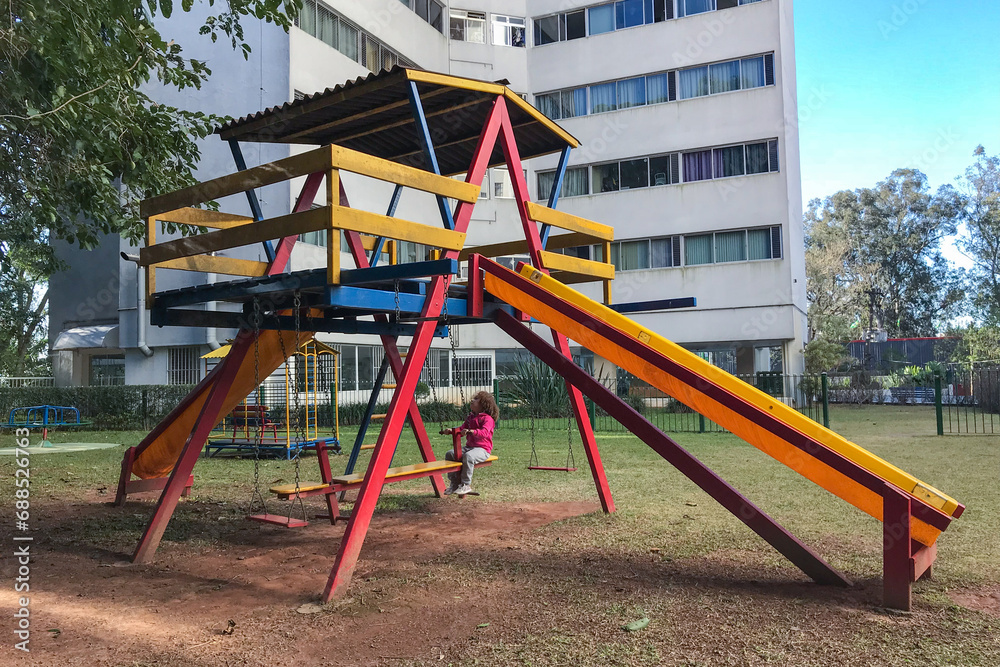 Causasian redhead girl playing in playground Causasian redhead girl playing in playground