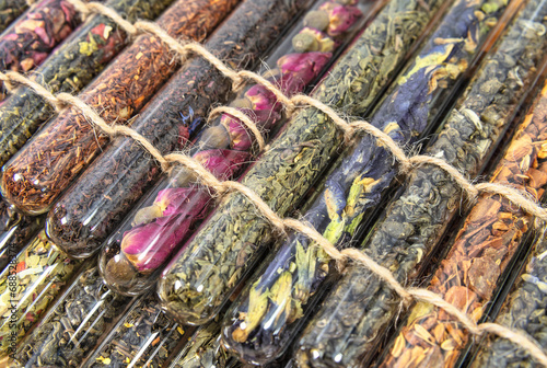 Different varieties of tea in glass tubes