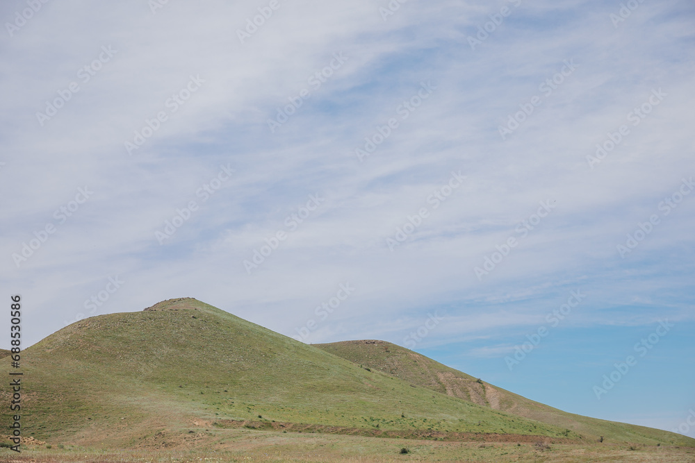 Fototapeta premium Beautiful landscape of mountains, rocks, green forest and blue sky