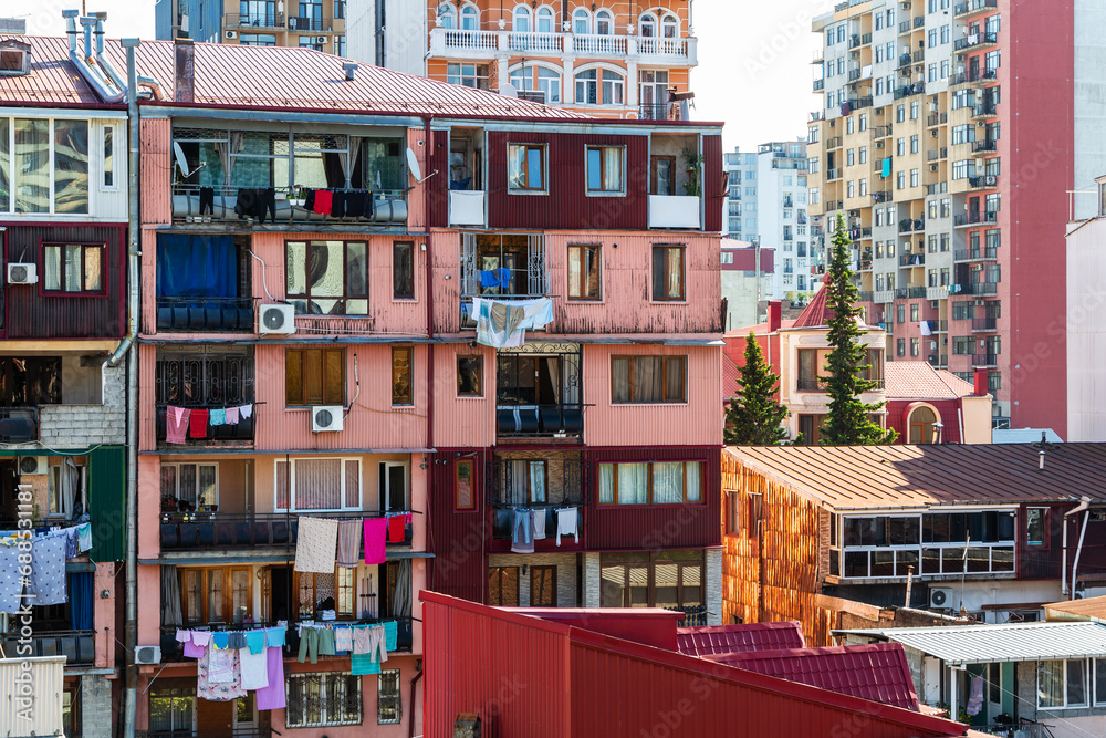 travel to Georgia - living houses in residential district in Batumi city with laundry drying on balcony on sunny morning