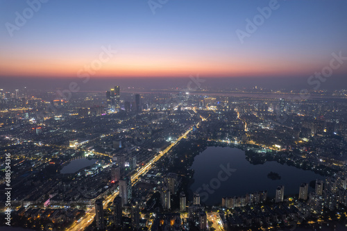 Aerial photography of the night view of Nanjing s Mochou Lake and the bustling city