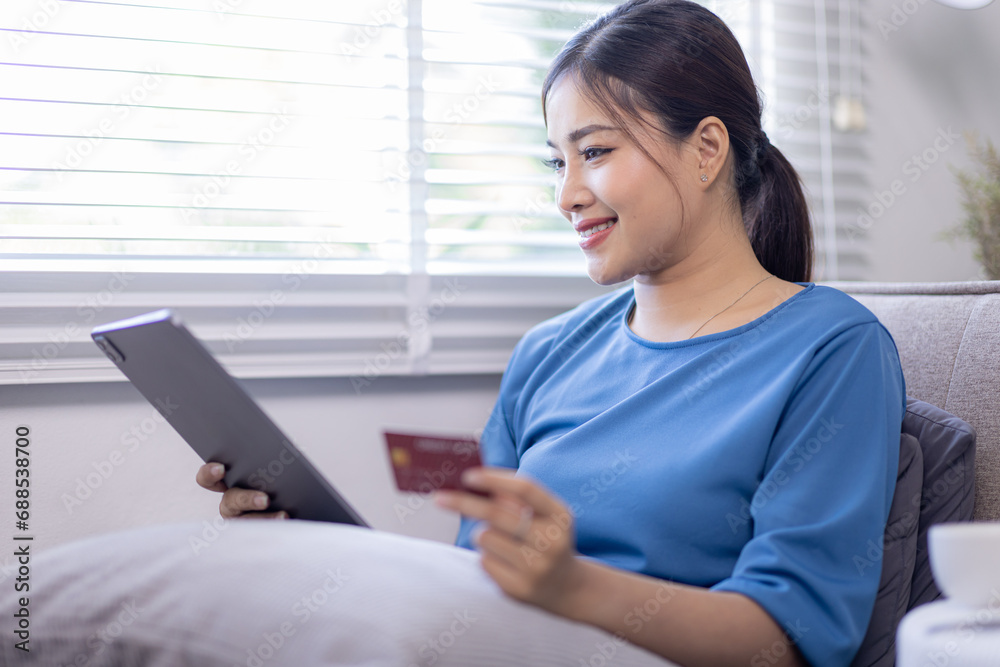 Mobile Shopping. Cheerful Asian Woman Using Smartphone Shopping Online Holding Credit Card Making Payment Sitting At Sofa At Home. Internet Banking Application And E-Commerce
Mobile Shopping. Cheerful Asian Woman Using Smartphone Shopping Online Holding Credit Card Making Payment Sitting At Sofa At Home. Internet Banking Application And E-Commerce