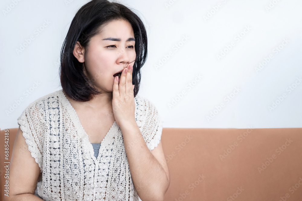 lack of sleep ,sleep deprivation concept with Asian woman yawning , sleepy and fatigue during daytime lack of sleep ,sleep deprivation concept with Asian woman yawning , sleepy and fatigue during daytime
