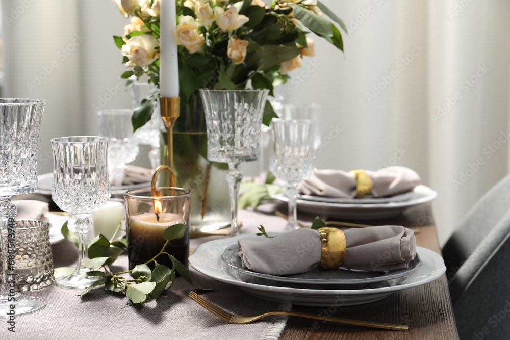 Beautiful table setting with floral decor indoors