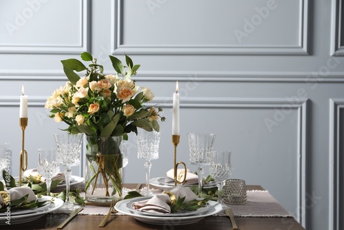 Beautiful table setting with floral decor indoors, space for text