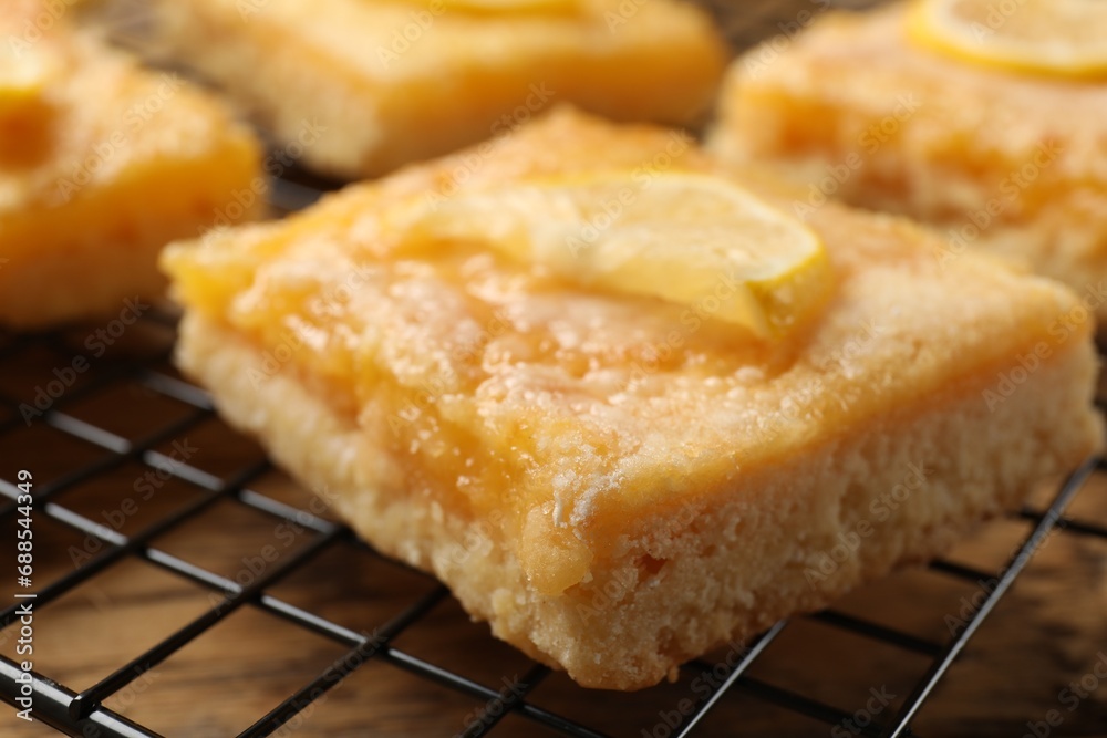 Tasty lemon bars on cooling rack, closeup Tasty lemon bars on cooling rack, closeup