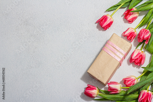 Zero waste spring gift concept. Pink tulips, surprise box for Anniversary, Mothers or Valentines Day