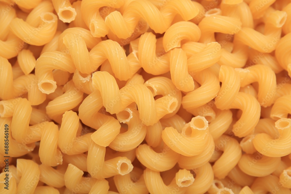 Raw cavatappi pasta as background, top view Raw cavatappi pasta as background, top view