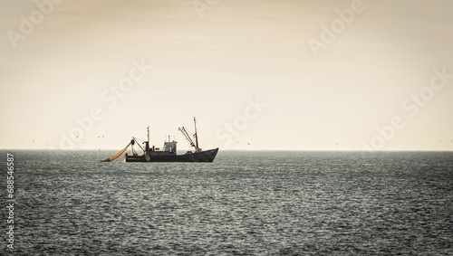 fishing trawler boat at open sea © S_E