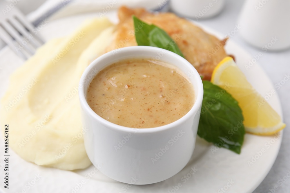 Delicious turkey gravy served on table, closeup Delicious turkey gravy served on table, closeup