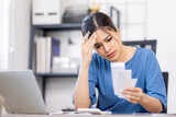 Frustrated desperate millennial woman checking bills for payments, holding receipts, getting upset about overspending, too high mortgage, insurance fees. Homeowner analyzing costs, expenses, budget