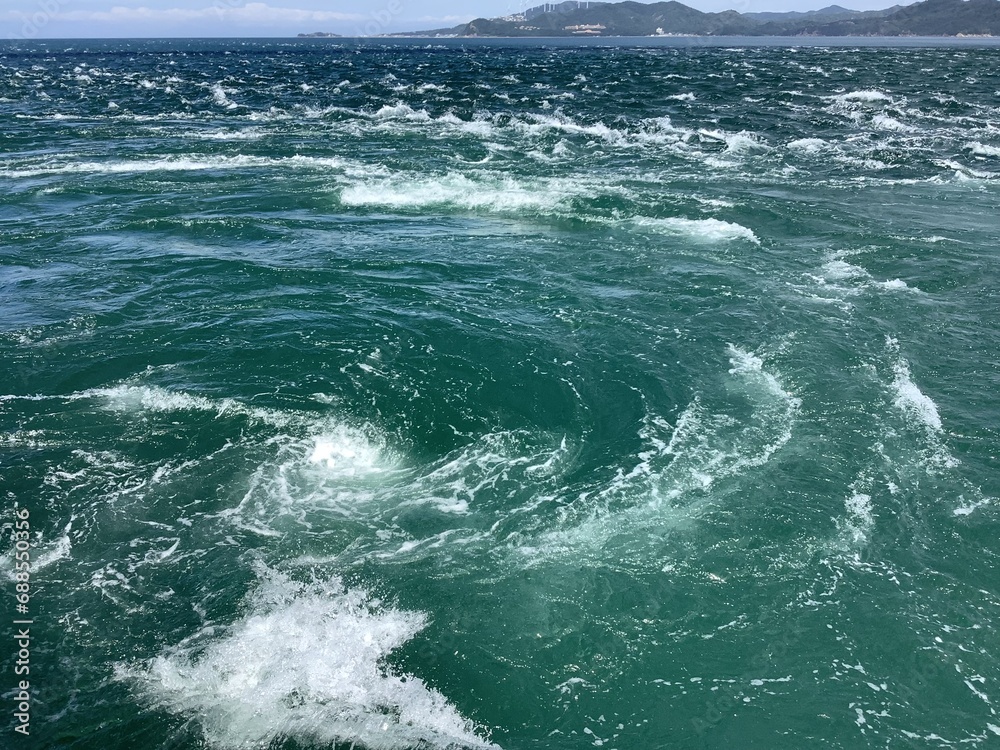 The Naruto whirlpools called Uzushio are tidal whirlpools in the Naruto Strait. The Naruto whirlpools called Uzushio are tidal whirlpools in the Naruto Strait.