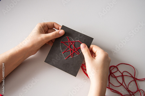 Making a card with a heart using thread printing for Valentine's Day photo