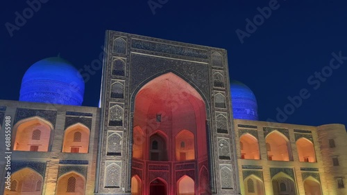 4K Orbiting Shot Showcasing Mir-i-Arab Madrasa at night in Bukhara Old Town, Uzbekistan. A true masterpiece of Islamic Spirituality, Education and Architecture. Religious complex near Po-i-Kalyan photo