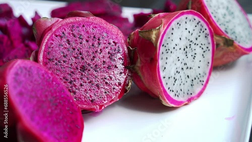 Panning shot Close up of Red and white dragonfruit Red Dragon Fruit Slices and Cultivating Exotic Plants pitaya photo