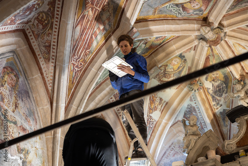 Equip of Expertise Restorers On a Working Platform Under Church Ceiling Restoring Beautiful Antique Gothic Fresco