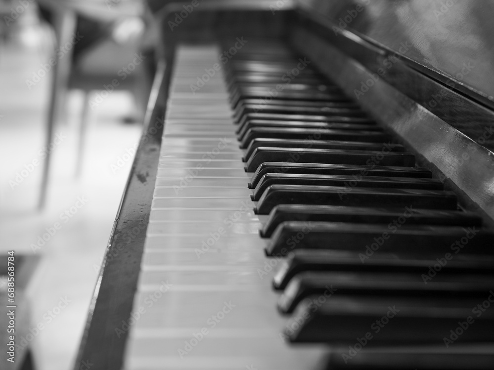 Playing an old wooden piano. Black and white image. Playing an old wooden piano. Black and white image.