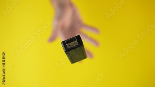 Hand throws USB stick in slow motion photo