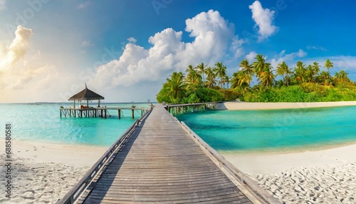 maldives island beach panorama palm trees and beach bar and long wooden pier pathway tropical vacation and summer holiday background concept photo