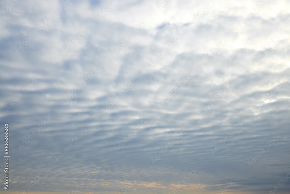 Fototapeta premium Layered gray clouds light sunrise