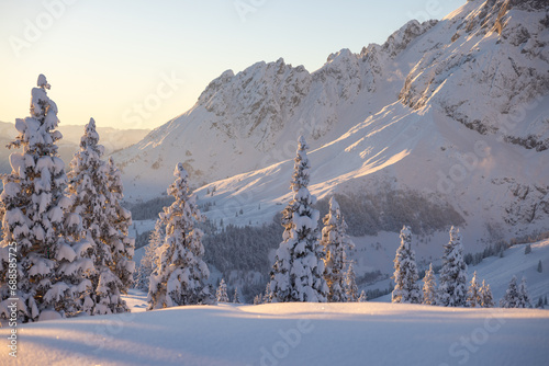 Snowy Austrian Alps during the sunset. Picturesque winter background 