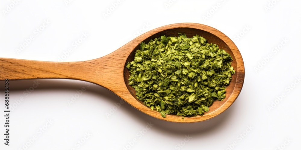 Dry Chopped Parsley Pile In Wooden Spoon On White Background. Food Ingredient. Top View Of Herb Condiment Heap. Aromatic Green Organic Spice. Dry Chopped Parsley Pile In Wooden Spoon On White Background. Food Ingredient. Top View Of Herb Condiment Heap. Aromatic Green Organic Spice.