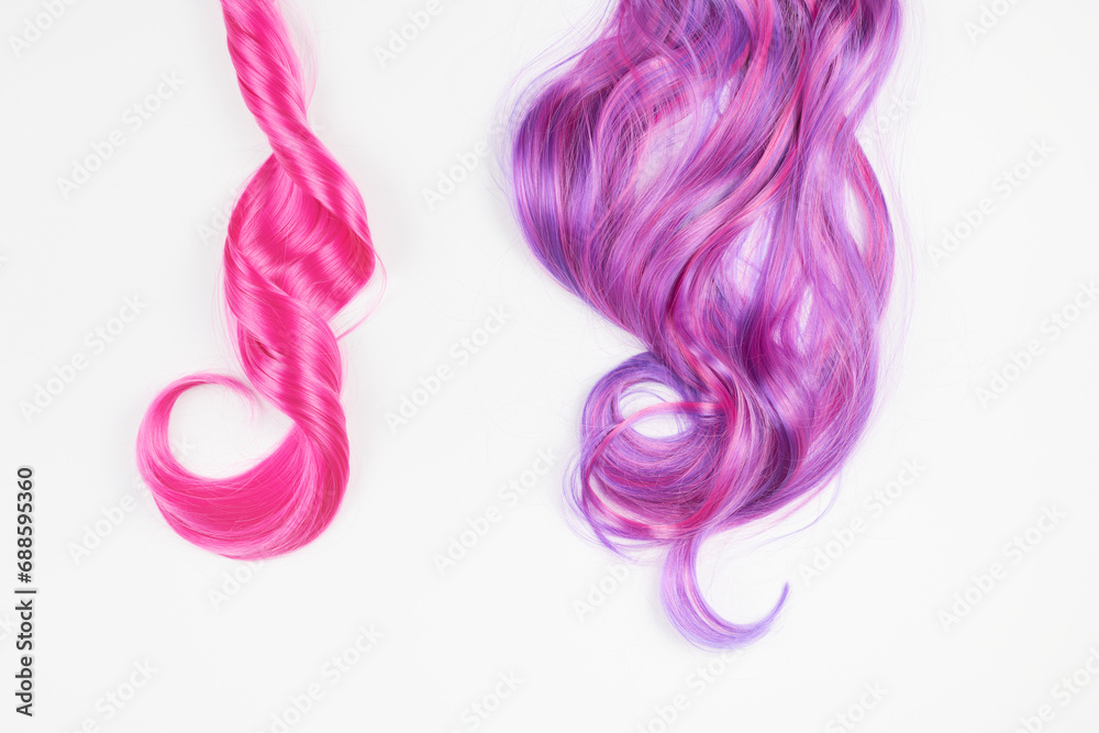 Natural looking shiny hair pink bright color, cosplay wig on a white background Natural looking shiny hair pink bright color, cosplay wig on a white background