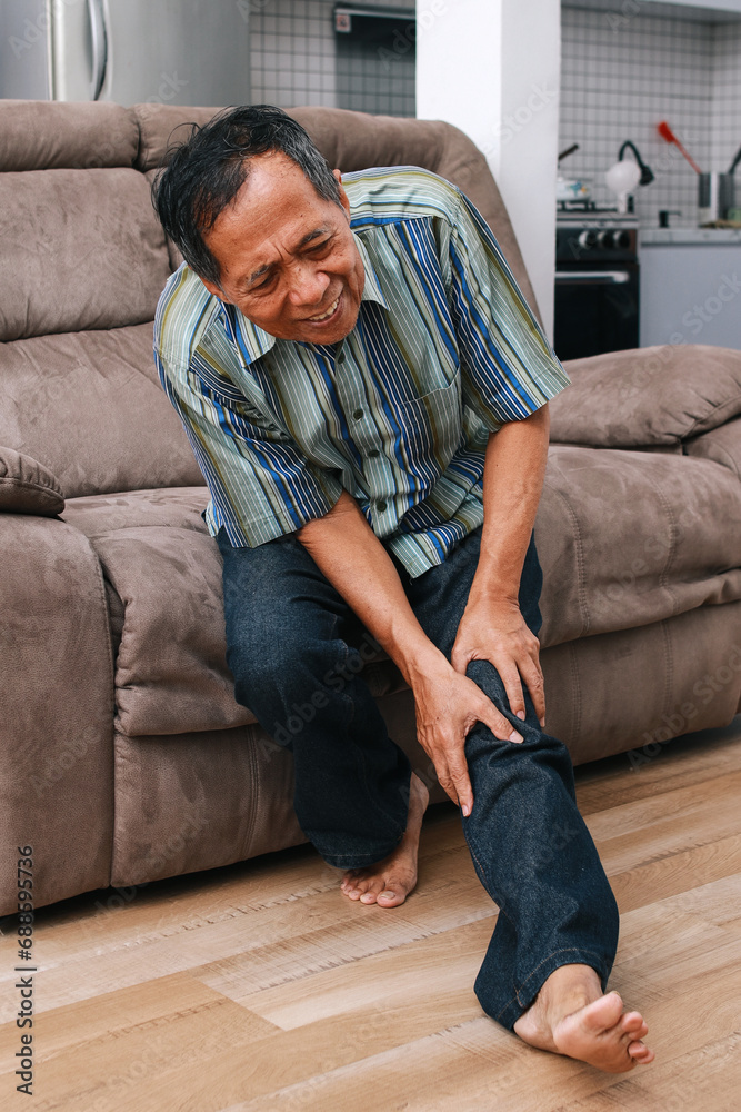 Elderly senior man suffering from knee ache at home. Elderly senior man suffering from knee ache at home.