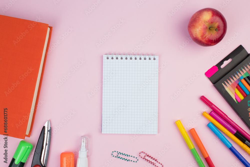 Back to school. Stationery on a pink table. Office desk with copy space. Flat lay. Back to school. Stationery on a pink table. Office desk with copy space. Flat lay.