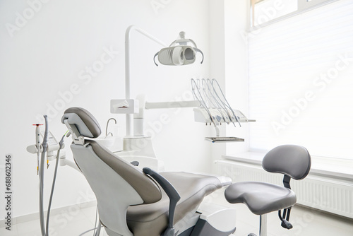 Dentist's office interior with modern chair and special dentisd equipment. Dentist office. Dentist chair in high class dental clinic. Dentist office. Medical concept. photo