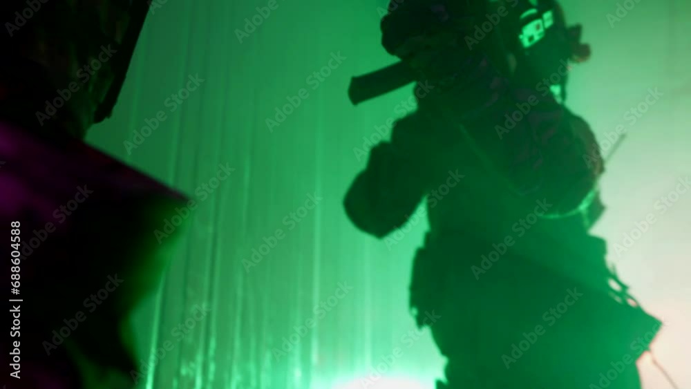 professional soldiers with weapons performing assault of building, active cinematic shot