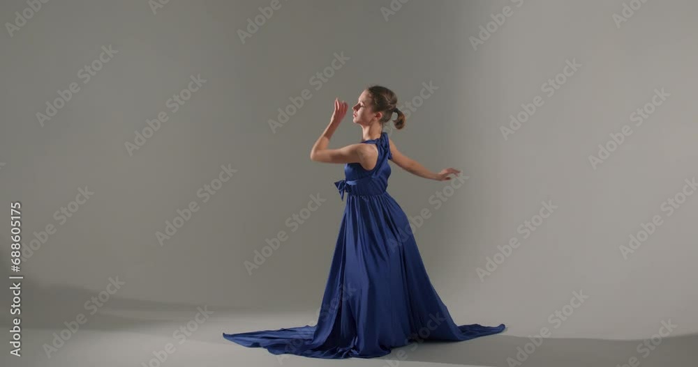 awesome beautiful slim girl in waving fabric performing at studio creative choreography female fit girl practising Choreography isolated grey white background awesome beautiful slim girl in waving fabric performing at studio creative choreography female fit girl practising Choreography isolated grey white background